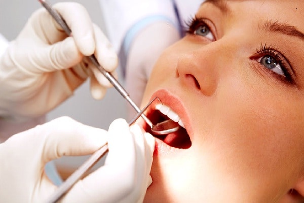 Nhổ răng khôn uống thuốc gì nhanh lành thương?
